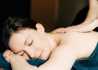 lady smiling while receiving back massage