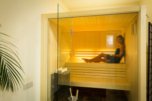 three day healthy spa break lady in towel in glass sauna